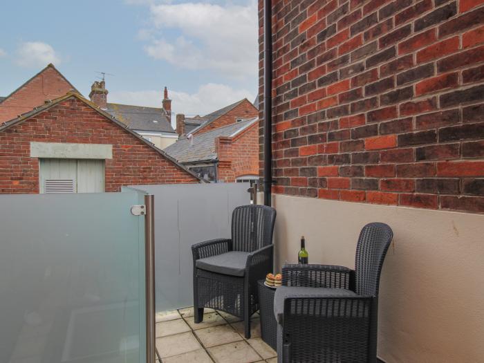 The Cottage, in Weymouth, Dorset. Close to amenities. Close to a beach. Smart TV. Enclosed balcony.