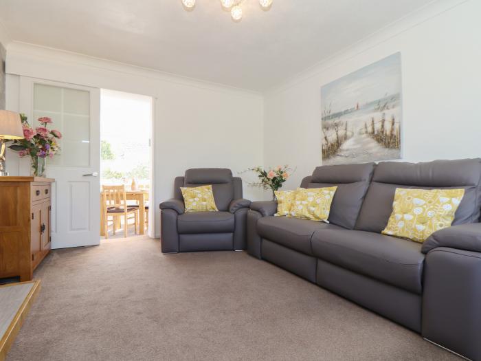 Compass Point, is in Camborne, Cornwall. Two-bedroom bungalow with enclosed gardens. Near amenities.