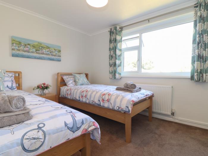 Compass Point, is in Camborne, Cornwall. Two-bedroom bungalow with enclosed gardens. Near amenities.