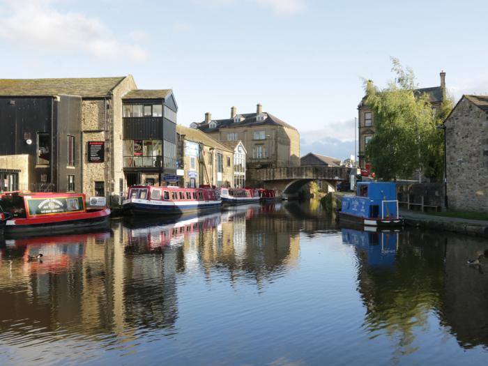 28 Water Street within Skipton, North Yorkshire. Mid-terrace cottage. Roadside parking & three beds.