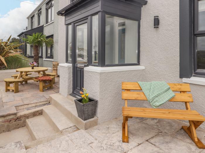 Bronyrhiw, in Goodwick, Pembrokeshire. Three-bedroom home with sea views and enclosed gardens. Pets.