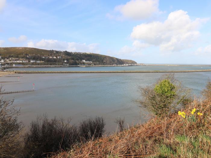 Bronyrhiw, in Goodwick, Pembrokeshire. Three-bedroom home with sea views and enclosed gardens. Pets.