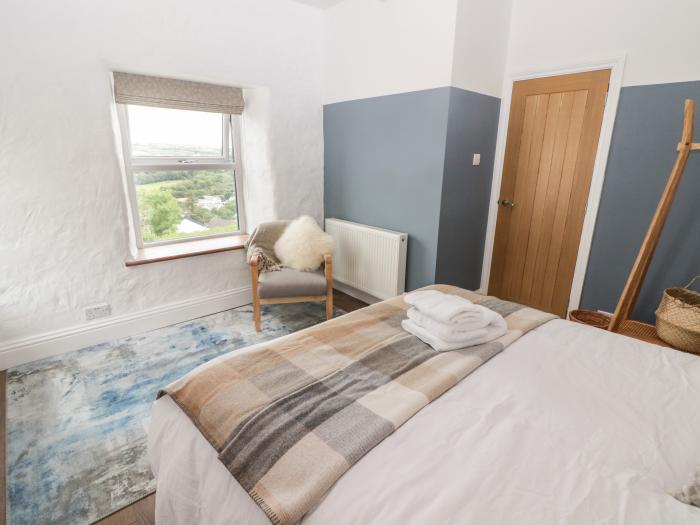 Bronyrhiw, in Goodwick, Pembrokeshire. Three-bedroom home with sea views and enclosed gardens. Pets.