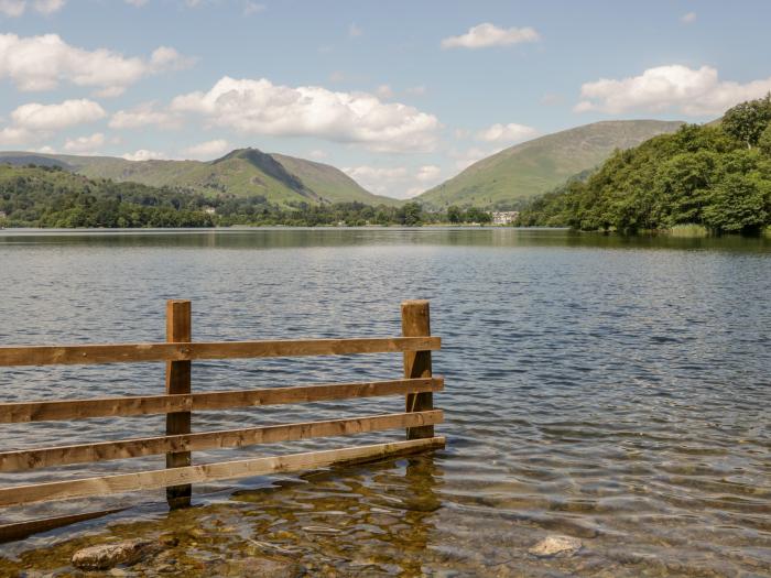 The Lodge, is in Ambleside, Cumbria. In Lake District National Park. Off-road parking. Near a lake.