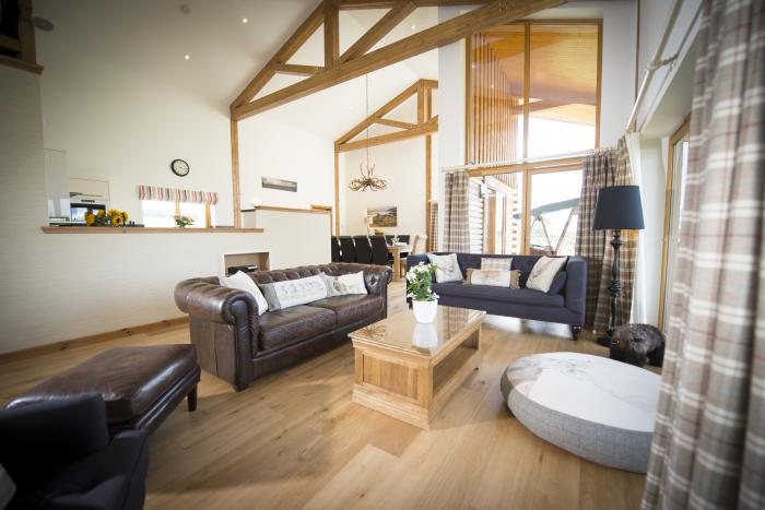 Aurae is in Cawdor, Highlands. Four-bedroom, luxury log cabin with hot tub and sauna. Rural. Family.