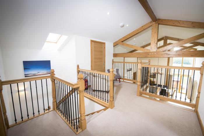 Aurae is in Cawdor, Highlands. Four-bedroom, luxury log cabin with hot tub and sauna. Rural. Family.