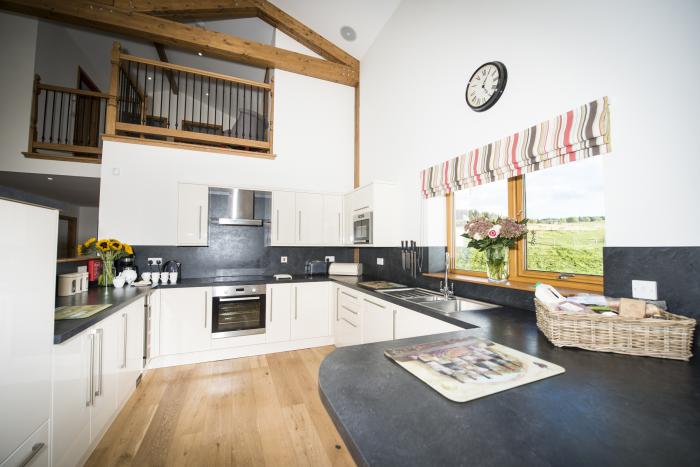 Aurae is in Cawdor, Highlands. Four-bedroom, luxury log cabin with hot tub and sauna. Rural. Family.