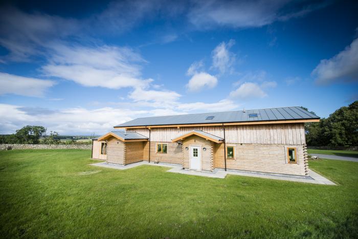 Aurae is in Cawdor, Highlands. Four-bedroom, luxury log cabin with hot tub and sauna. Rural. Family.