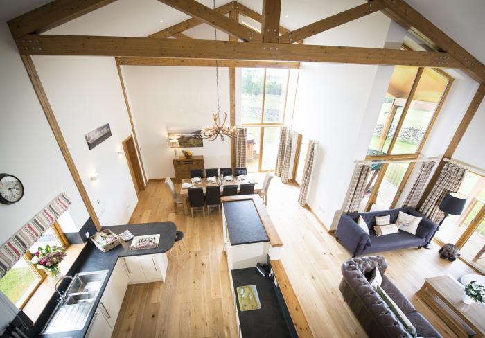 Aurae is in Cawdor, Highlands. Four-bedroom, luxury log cabin with hot tub and sauna. Rural. Family.