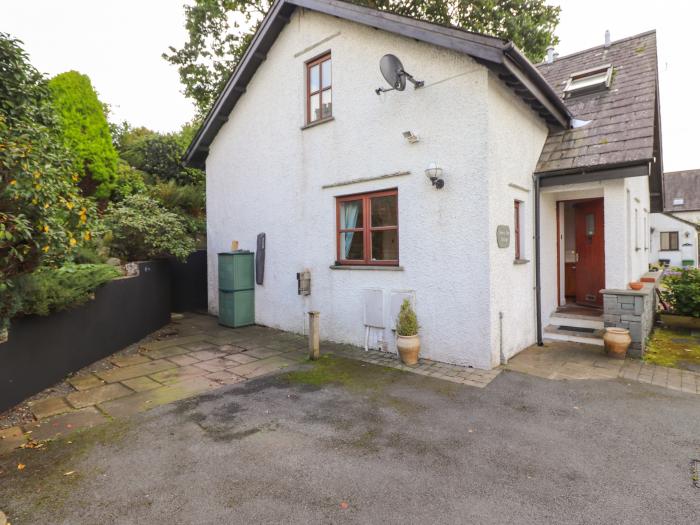 Cherry Tree Cottage is in Windermere, Cumbria. Two-bedroom cottage in National Park. Near amenities.