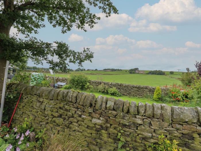 Marsh Cottage in Oxenhope, West Yorkshire. Two-bedroom cottage enjoying rural views. Private garden.