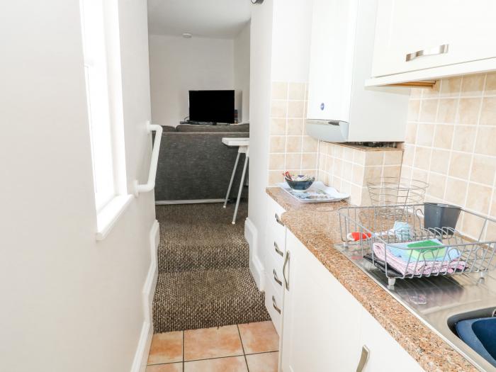 Apartment 12 Trinity Mews, in Torquay, Devon. Ground-floor apartment near beach and amenities. Pets.