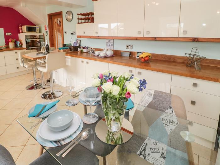 Coast Cottage, Bamburgh, Northumberland. Two-bedroom home resting near the beach and amenities. Pets