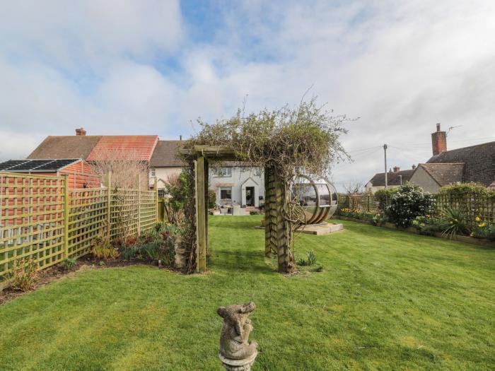 Coast Cottage, Bamburgh, Northumberland. Two-bedroom home resting near the beach and amenities. Pets