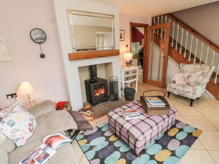 Coast Cottage, Bamburgh, Northumberland. Two-bedroom home resting near the beach and amenities. Pets