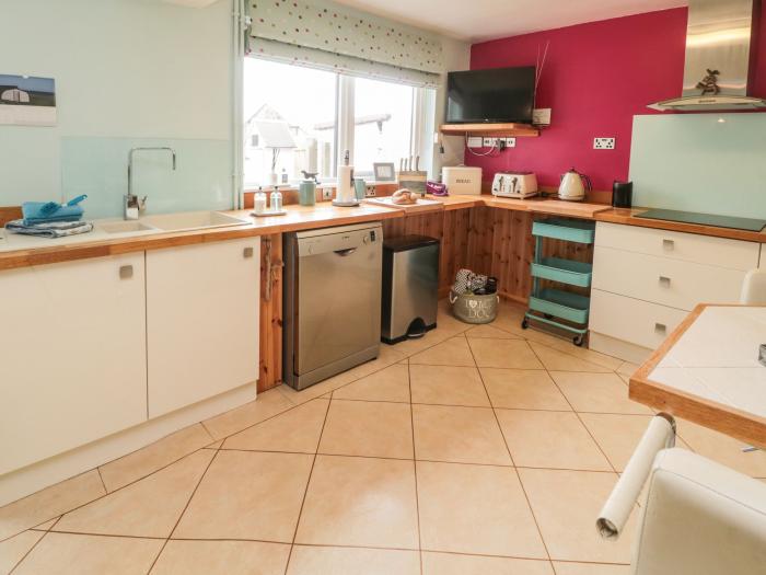 Coast Cottage, Bamburgh, Northumberland. Two-bedroom home resting near the beach and amenities. Pets