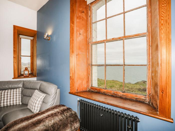 West Lighthouse Keeper's Cottage near Amlwch. Three-bedroom bungalow with sea views. Coastal. Patio.