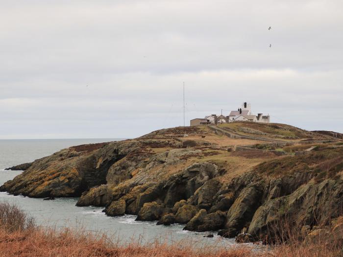 West Lighthouse Keeper's Cottage near Amlwch. Three-bedroom bungalow with sea views. Coastal. Patio.