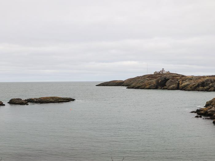 West Lighthouse Keeper's Cottage near Amlwch. Three-bedroom bungalow with sea views. Coastal. Patio.