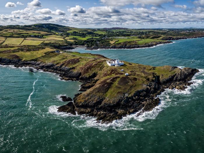 West Lighthouse Keeper's Cottage near Amlwch. Three-bedroom bungalow with sea views. Coastal. Patio.