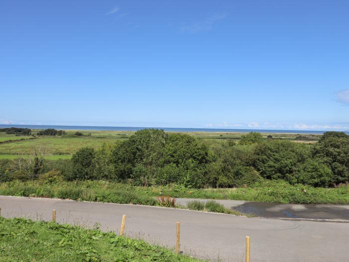 The Stargazer in Gronant, Denbighshire. One-bedroom, stylish home with distant sea views. Near beach