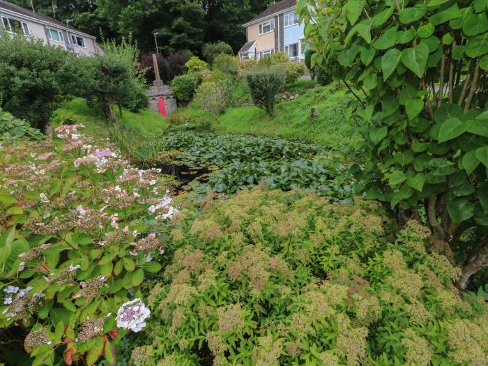 No.7 Merlin Gardens is in Tenby, Pembrokeshire. Two-bedroom chalet with enclosed garden. Near beach.