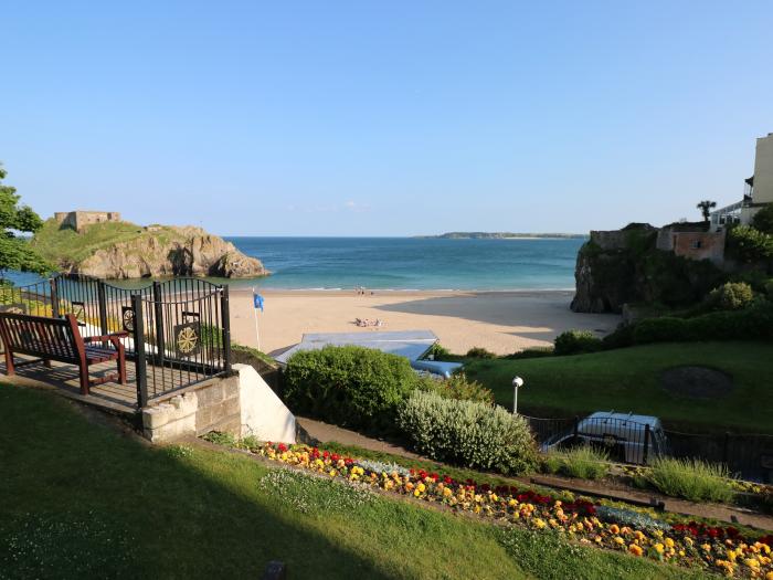 No.7 Merlin Gardens is in Tenby, Pembrokeshire. Two-bedroom chalet with enclosed garden. Near beach.