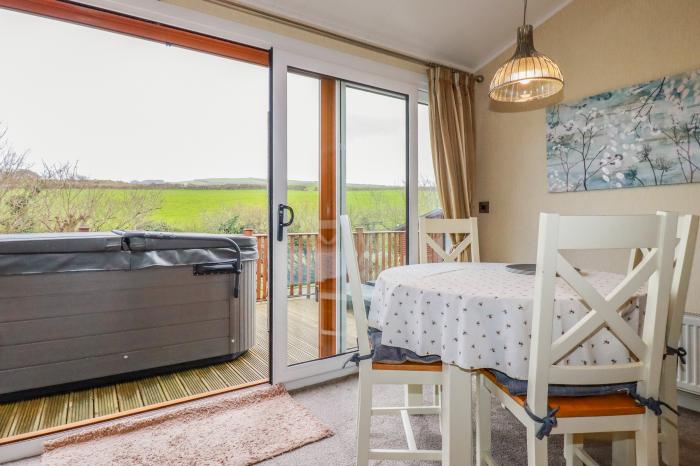 25 Bossiney Bay, near Tintagel, Cornwall. Two-bedroom lodge with rural views and hot tub. Open-plan.