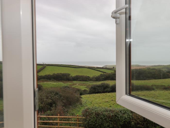 Halls Farm is near Poughill, Cornwall. Close to amenities and beach. Open fire. Smart TV. Sea views.