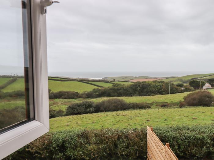 Halls Farm is near Poughill, Cornwall. Close to amenities and beach. Open fire. Smart TV. Sea views.