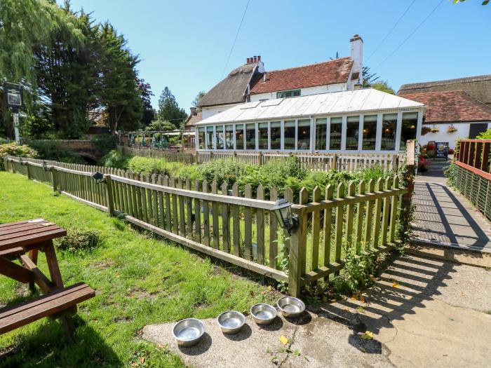 Northern Byre rests in Sopley, Hampshire. Four-bedroom barn conversion, resting near amenities. Pets