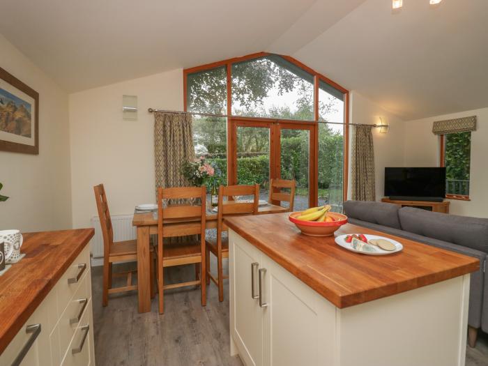 Bay Tree Lodge, Cartmel, Cumbria. Single-storey. Woodburning stove. Decking with furniture. Smart TV