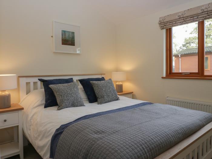 Bay Tree Lodge, Cartmel, Cumbria. Single-storey. Woodburning stove. Decking with furniture. Smart TV