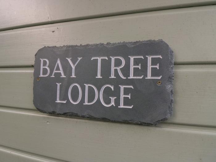 Bay Tree Lodge, Cartmel, Cumbria. Single-storey. Woodburning stove. Decking with furniture. Smart TV