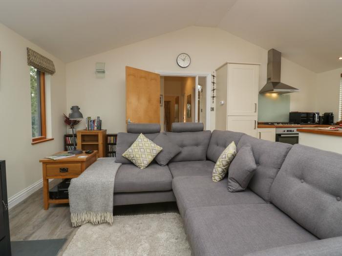 Bay Tree Lodge, Cartmel, Cumbria. Single-storey. Woodburning stove. Decking with furniture. Smart TV