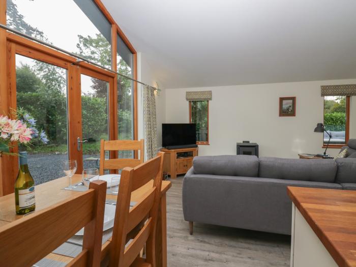 Bay Tree Lodge, Cartmel, Cumbria. Single-storey. Woodburning stove. Decking with furniture. Smart TV