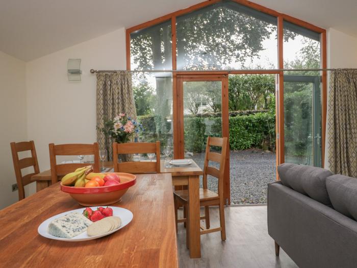 Bay Tree Lodge, Cartmel, Cumbria. Single-storey. Woodburning stove. Decking with furniture. Smart TV