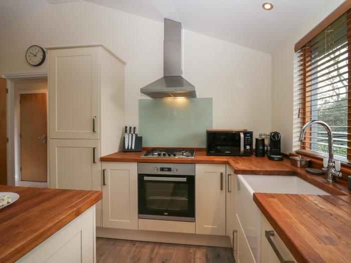 Bay Tree Lodge, Cartmel, Cumbria. Single-storey. Woodburning stove. Decking with furniture. Smart TV