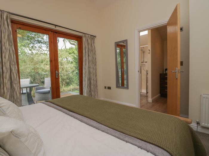 Bay Tree Lodge, Cartmel, Cumbria. Single-storey. Woodburning stove. Decking with furniture. Smart TV