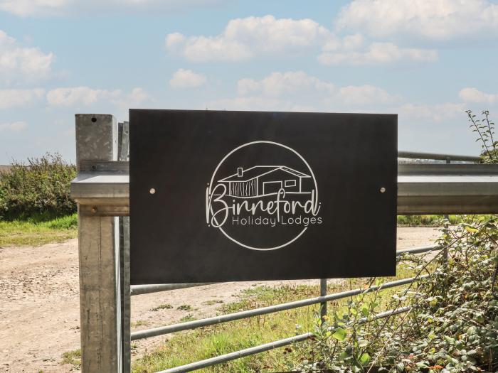 Foxglove Lodge in Hittisleigh, Devon. Detached lodge. Open-plan living space with woodburning stove.