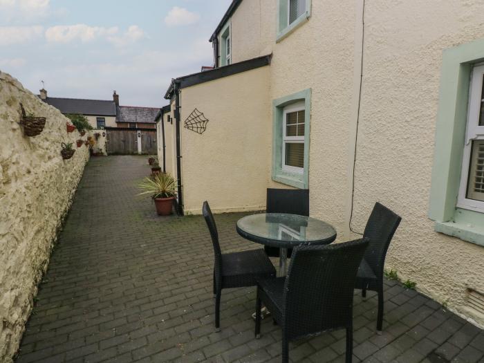 Cobwebs Corner is in Porthcawl, Bridgend. Three-bedroom home resting near beach and amenities. Pets.