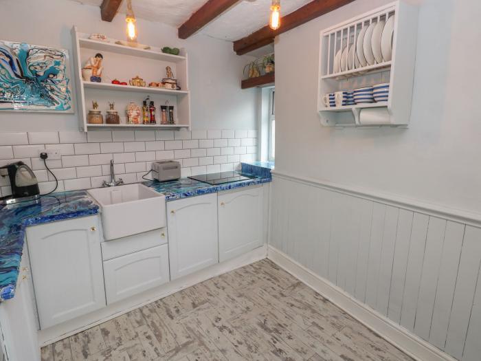 Cobwebs Corner is in Porthcawl, Bridgend. Three-bedroom home resting near beach and amenities. Pets.