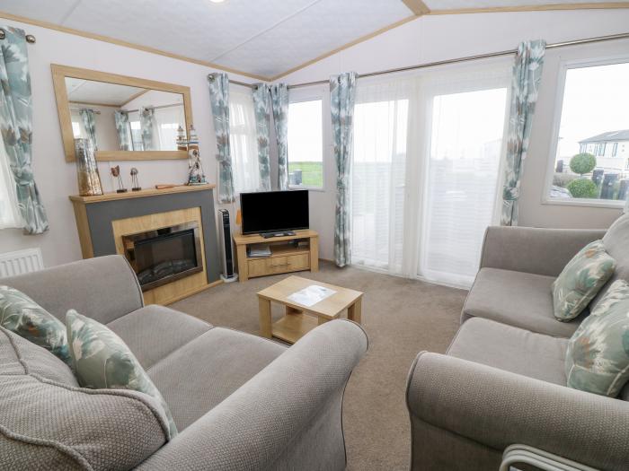 Seafront Holiday Home 1, Pwllheli. Three-bedroom lodge, enjoying sea views. Near amenities and beach