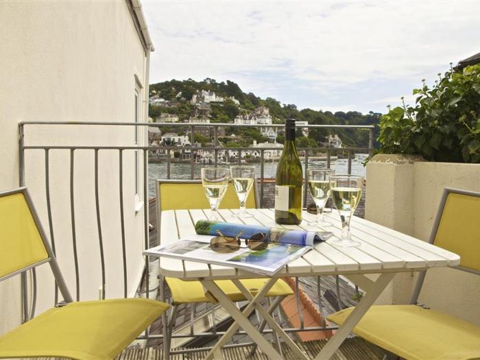 Harbourside, is in Dartmouth, Devon. First-floor apartment with sea views. Near amenities and beach.