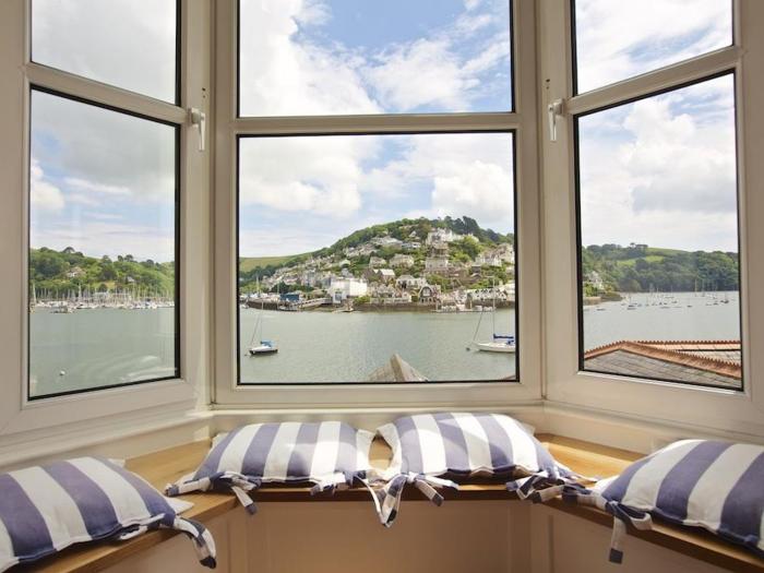 Harbourside, is in Dartmouth, Devon. First-floor apartment with sea views. Near amenities and beach.