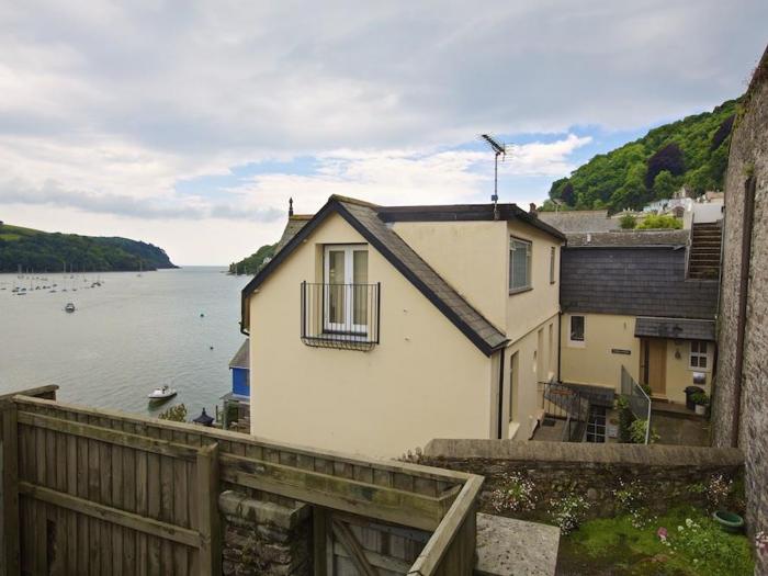 Harbourside, is in Dartmouth, Devon. First-floor apartment with sea views. Near amenities and beach.