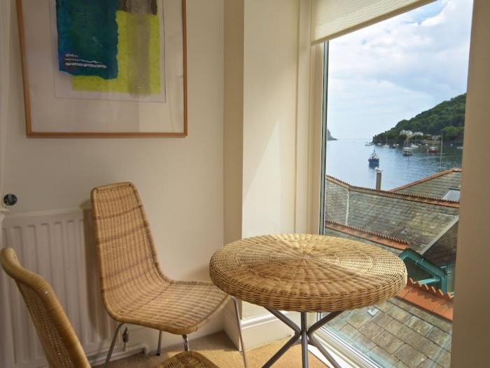 Harbourside, is in Dartmouth, Devon. First-floor apartment with sea views. Near amenities and beach.