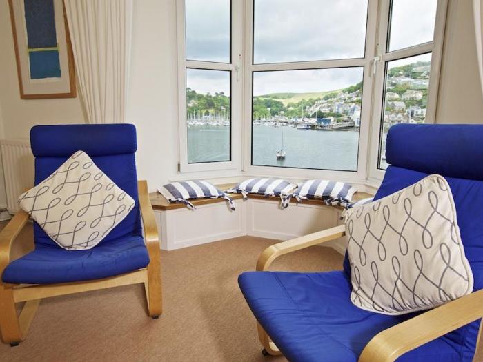 Harbourside, is in Dartmouth, Devon. First-floor apartment with sea views. Near amenities and beach.