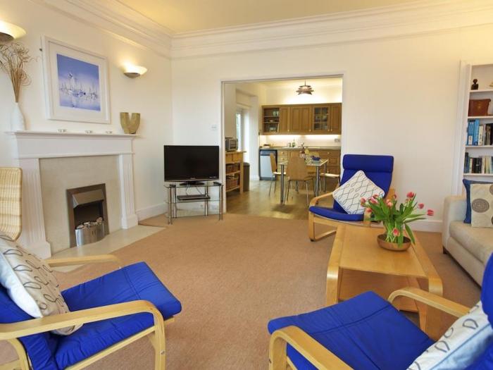 Harbourside, is in Dartmouth, Devon. First-floor apartment with sea views. Near amenities and beach.