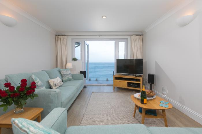 Wavetop is in Carbis Bay, Cornwall. Penthouse apartment with stunning sea views. Near beach. Stylish